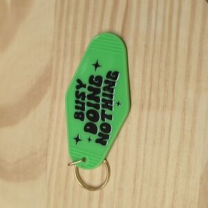 Busy doing nothing bright green key chain